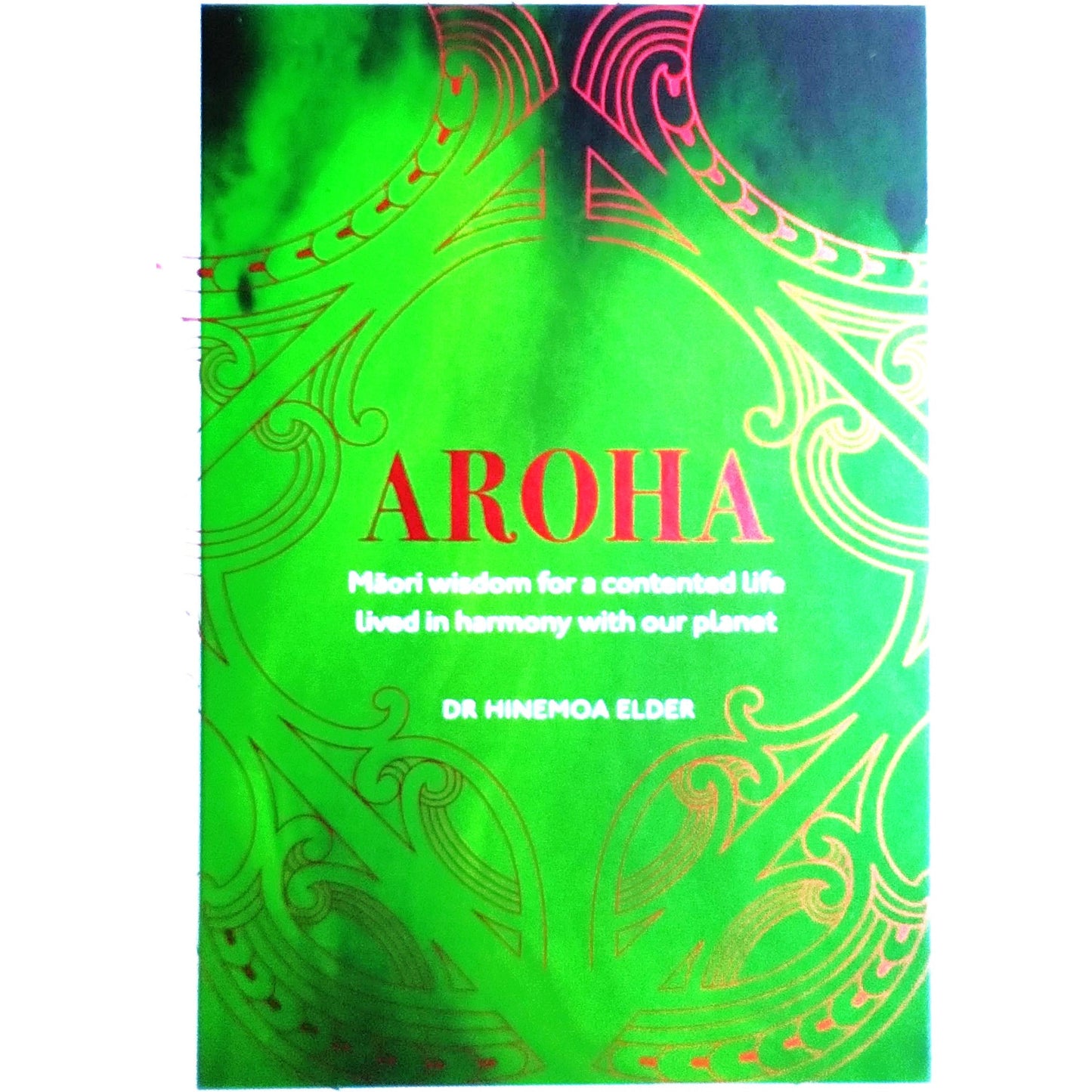 Green picture of the neck and back of a tatooed human figure.