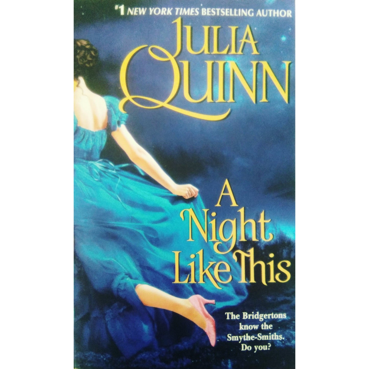 A night like this title. Female in blue dress and pink heels .